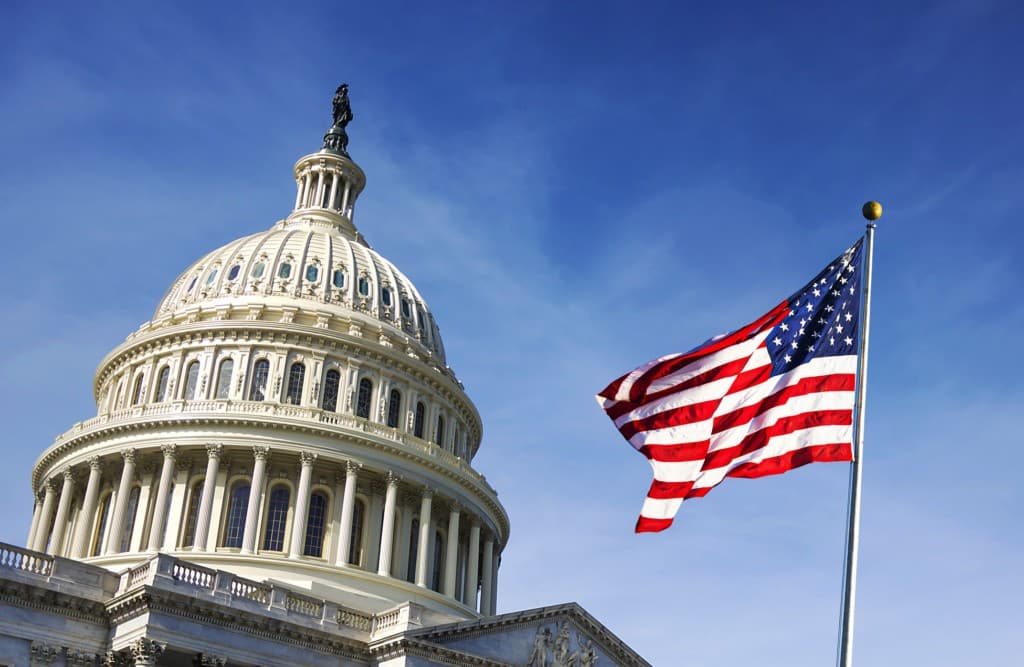 The U.S. Capitol dome with an American flag waving beside it, representing Princeton’s public and international affairs programs.